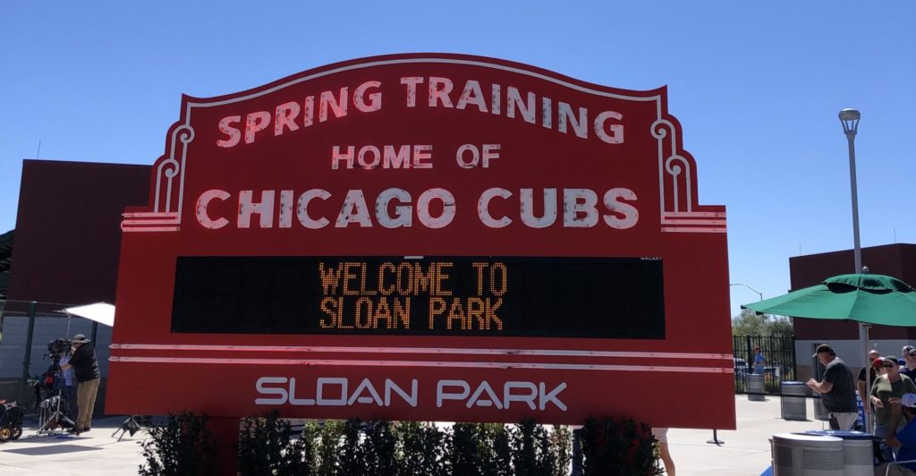 Picture of the iconic red Chicago Cubs marquee. The sign reads "Spring Training Home of the Chicago Cubs" "Welcome to Sloan Park".